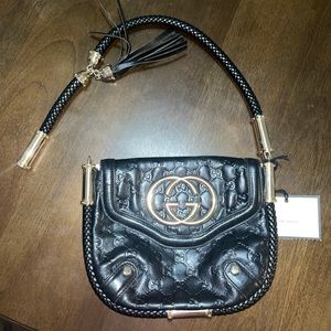 Gucci Guccissima black leather Britt clutch w/ tassel